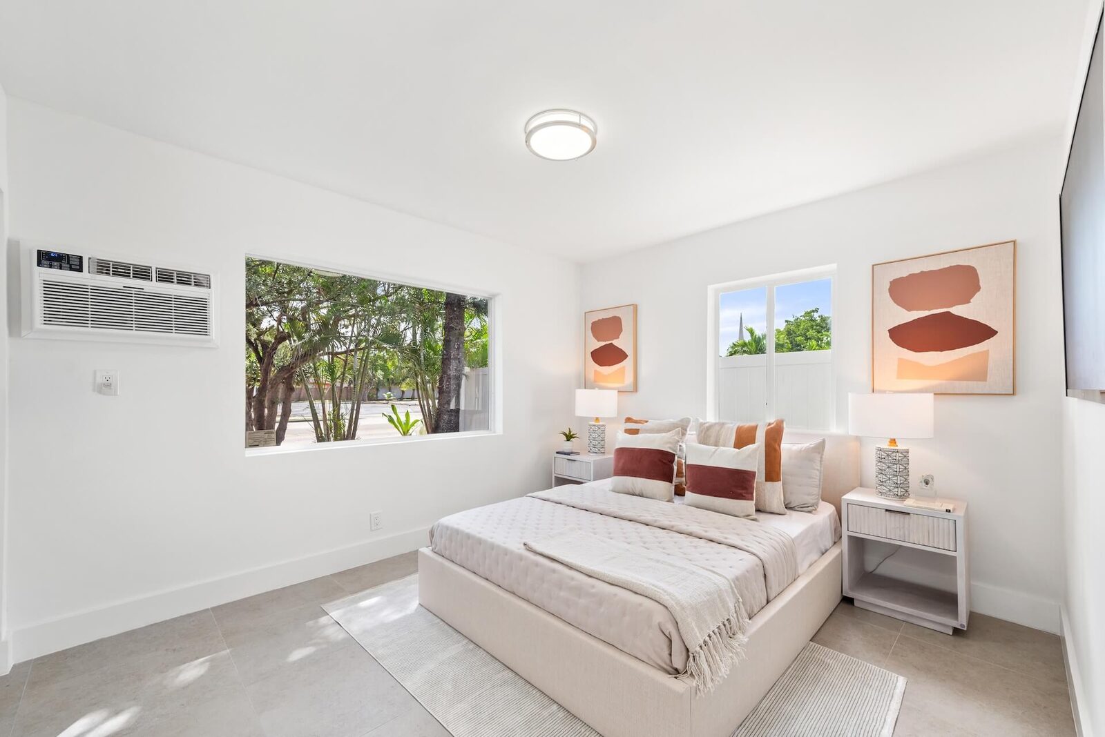 Bright, staged primary bedroom